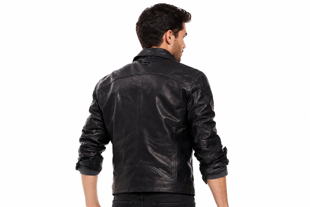 Back view of a man wearing the black The Renegade Heavyweight Biker Jacket featuring a fold-down collar and zippered chest pocket.