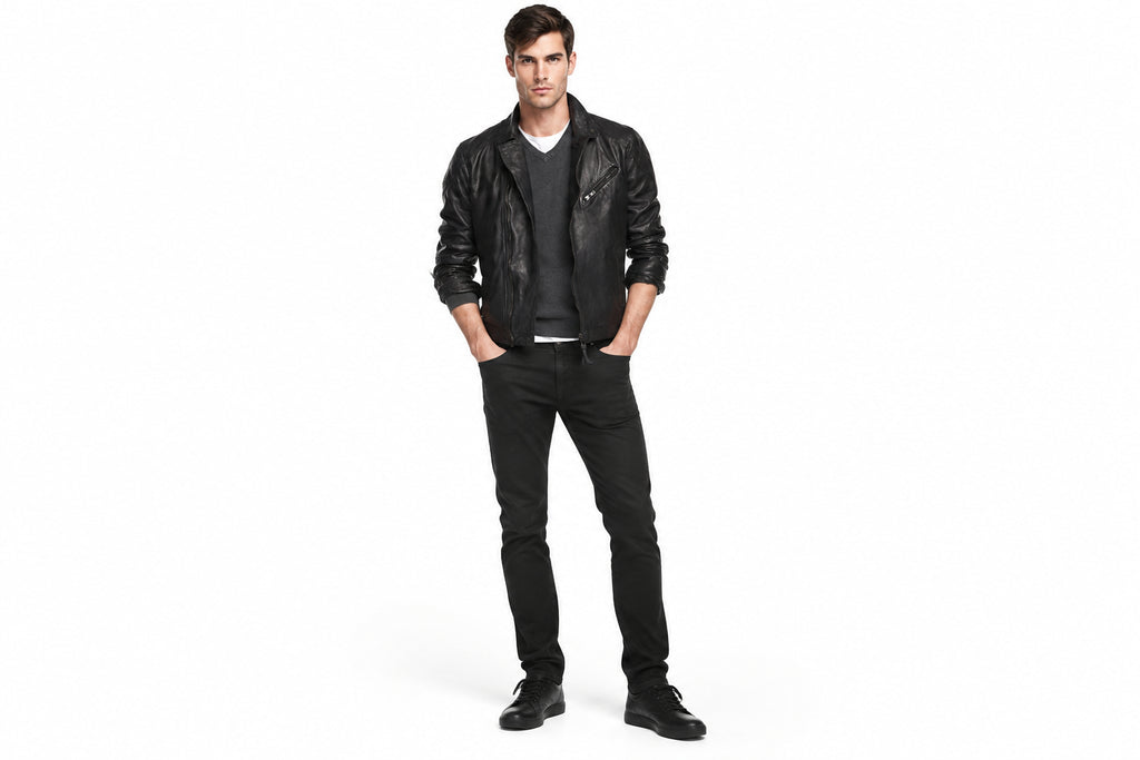 Front view of a man wearing the black The Renegade Heavyweight Biker Jacket featuring a fold-down collar and zippered chest pocket.