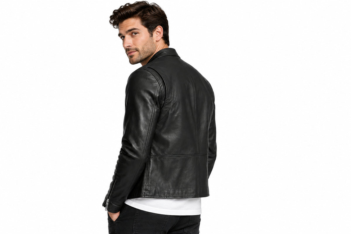 Back view of a man wearing the black The Sovereign Black Leather Biker Jacket featuring a stand collar and asymmetrical zipper.