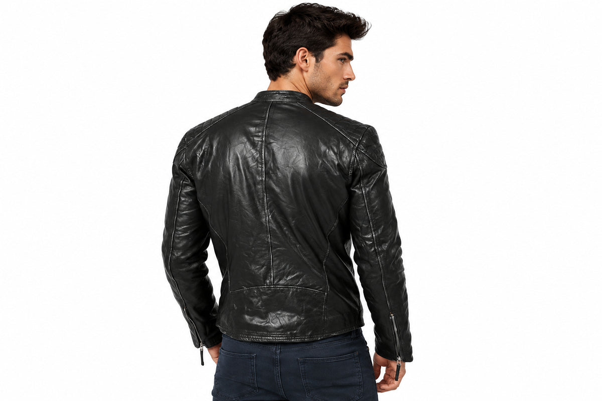 Back view of a man wearing the black The Streamline Leather Racer Jacket featuring a stand collar and zippered chest pocket.