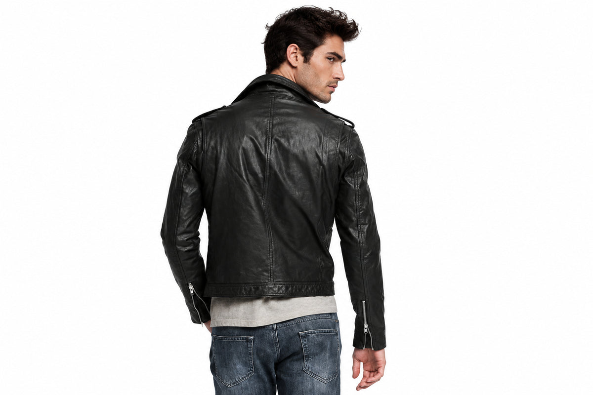 Back view of a man wearing the black The Strider Leather Racer Jacket featuring notched lapels and an asymmetrical zipper.