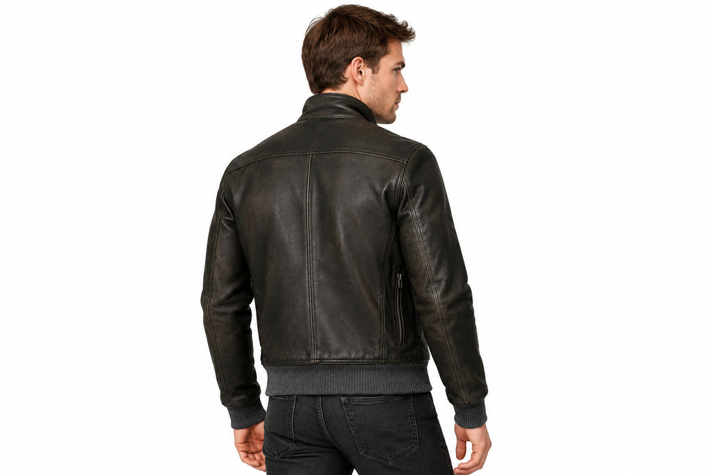 Back view of a man wearing the black The Timberland Vintage Rider Jacket featuring a stand collar and full-zip closure.