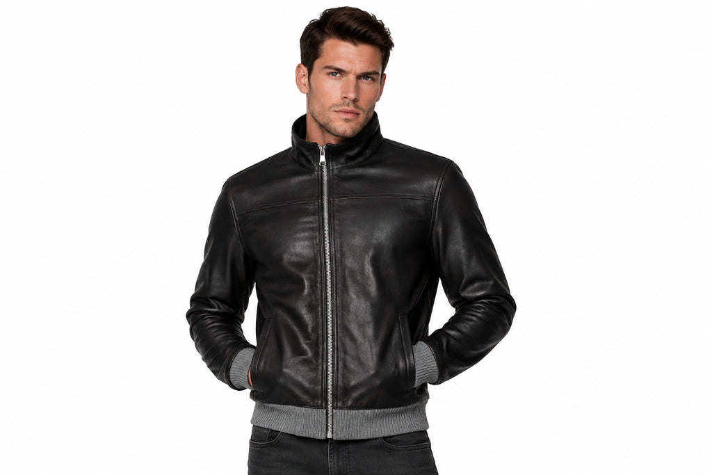 Front view of a man wearing the black The Timberland Vintage Rider Jacket featuring a stand collar and full-zip closure.
