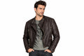 Front view of a man wearing the brown The Vanguard Modern Moto Jacket featuring a stand collar and asymmetrical zipper.