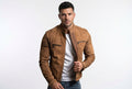 Front view of a man wearing the tan Thunder Grain Sovereign Suede Leather Jacket featuring pleated placket detail and ribbed shoulder panels.