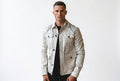 Front view of a man wearing the white Thunder Trail White Genuine Biker Leather Jacket featuring four flap pockets and contrast black buttons.