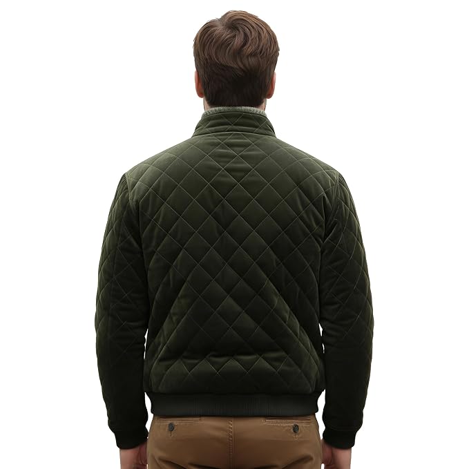 Back view of a man wearing the olive green Timeless Edge Olive Green Suede Leather Jacket featuring diamond quilting and a stand collar.