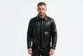 Front view of a man wearing the black Titan Road Modern Cut Lambskin Racer Jacket featuring dual flap cargo pockets and a shirt collar.