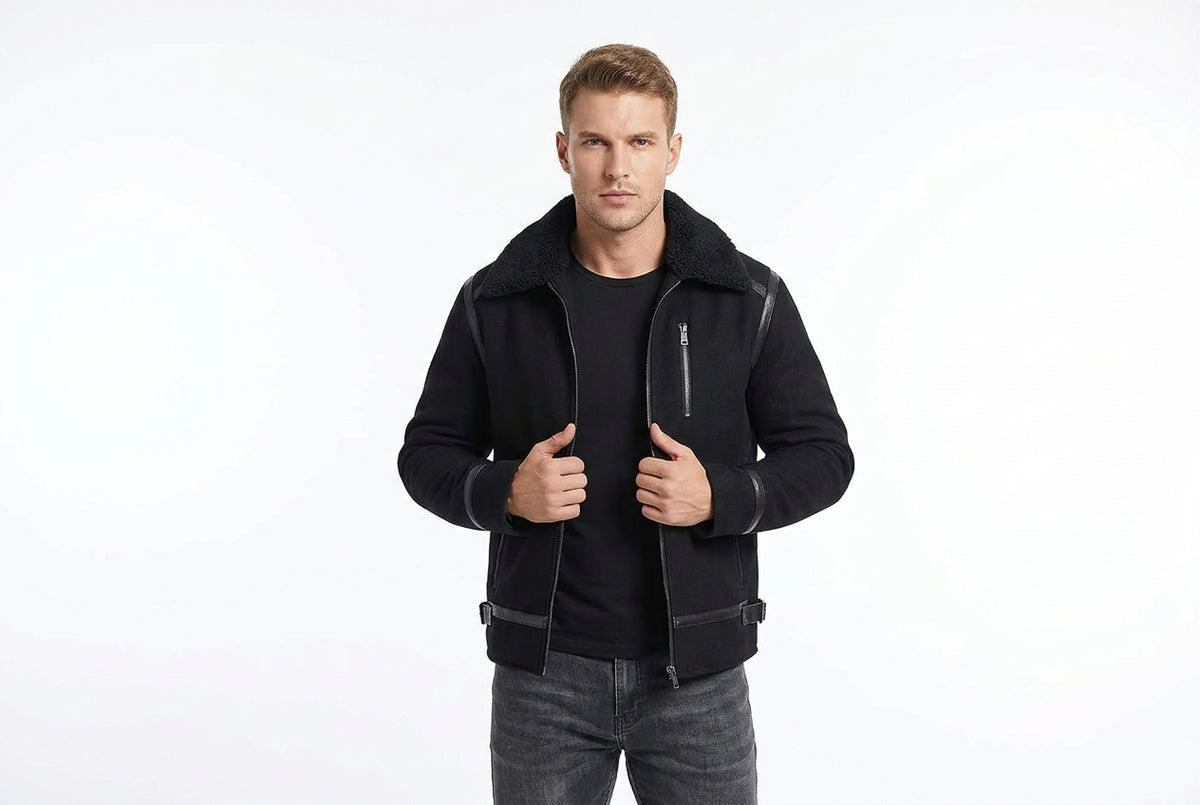 Front view of a man wearing the black Titan Weave Elite Mode Suede Jacket featuring a plush fur collar and smooth leather trim piping.