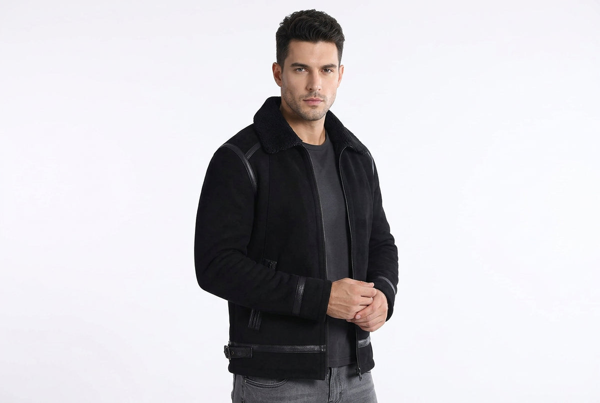 Side view of a man wearing the black Titan Weave Elite Mode Suede Jacket featuring a plush fur collar and smooth leather trim piping.
