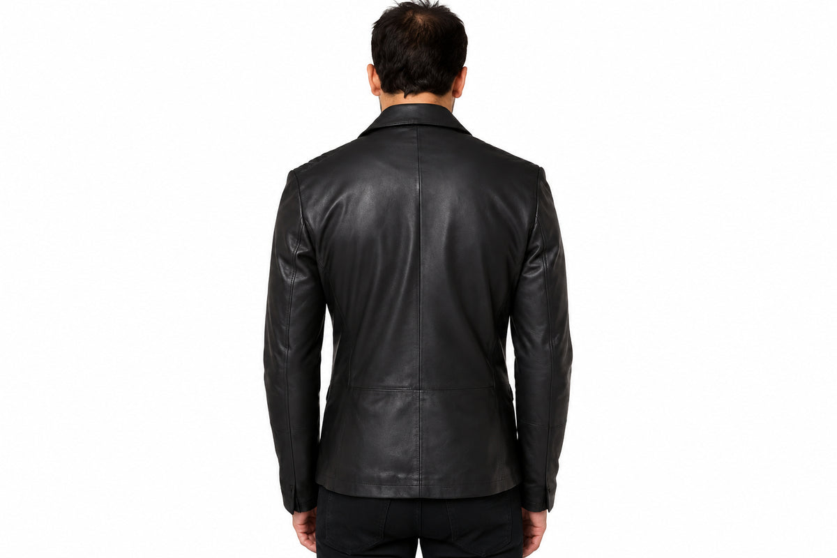 Back view of a man wearing the black Urban-Craft Asymmetrical Jacket featuring notched lapels and an asymmetrical zipper.