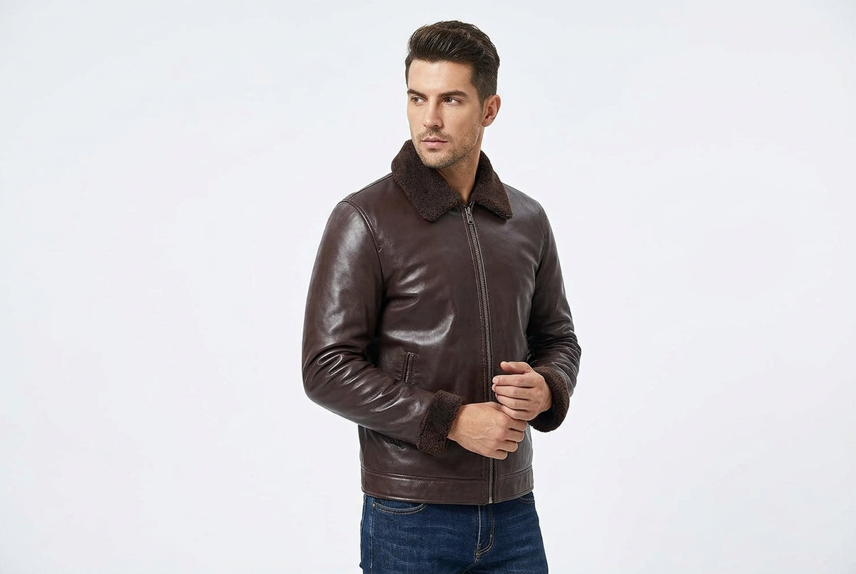 Side view of a man wearing the dark brown Urban Gear Heritage Genuine Biker Leather Jacket featuring a shearling-lined collar and turn-back cuffs.