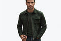 Front view of a man wearing the dark green Urban Pelt Luxe Heritage Suede Leather Jacket featuring dual chest flap pockets and a shirt collar.
