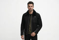 Front view of a man wearing the black Urban Throttle Black Suede Leather Jacket featuring a plush fur collar and zippered cuffs.