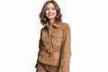 Urbanwolf women's camel tan genuine soft suede real leather safari jacket featuring a fold-over collar, snap-button front closure, four buttoned flap patch pockets, matching adjustable suede belt with metal buckle, long fitted sleeves, and custom made-to-measure fitting across the UK, USA, and Australia.