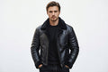 Front view of a man wearing the jet black Wild Rogue Luxe Icon Real Leather RacerJacket featuring a black shearling collar and chest patch pocket.