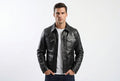 Front view of a man wearing the jet black Wolf Crest Cafe Racer Genuine Biker Leather Jacket featuring four button-flap utility pockets and a shirt collar.
