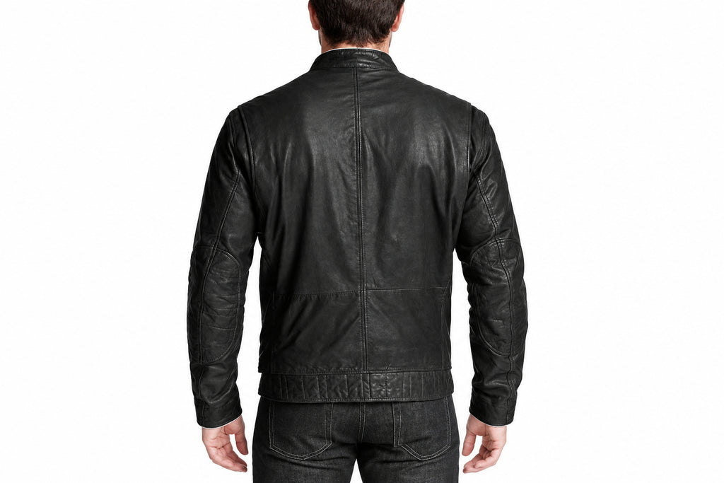Back view of a man wearing the Zenith Band-Collar Biker Jacket featuring a band collar and zippered chest pocket.