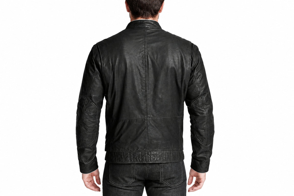 Back view of a man wearing the Zenith Band-Collar Biker Jacket featuring a band collar and zippered chest pocket.