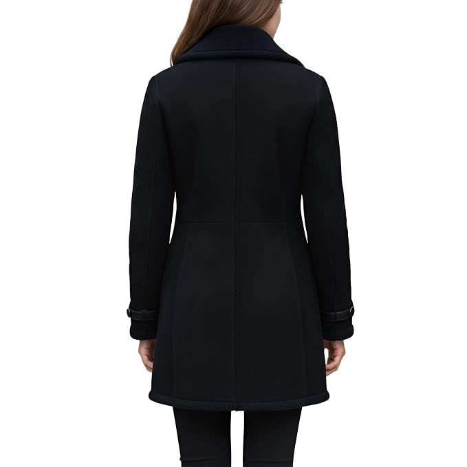 Zenith Rose women's jet black genuine suede leather elegant overcoat featuring a plush tonal black shearling-lined collar, single-breasted button closure, leather-trimmed cuff straps, side welt pockets, mid-thigh length fit, and custom made-to-measure fitting across the UK, USA, and Australia.back